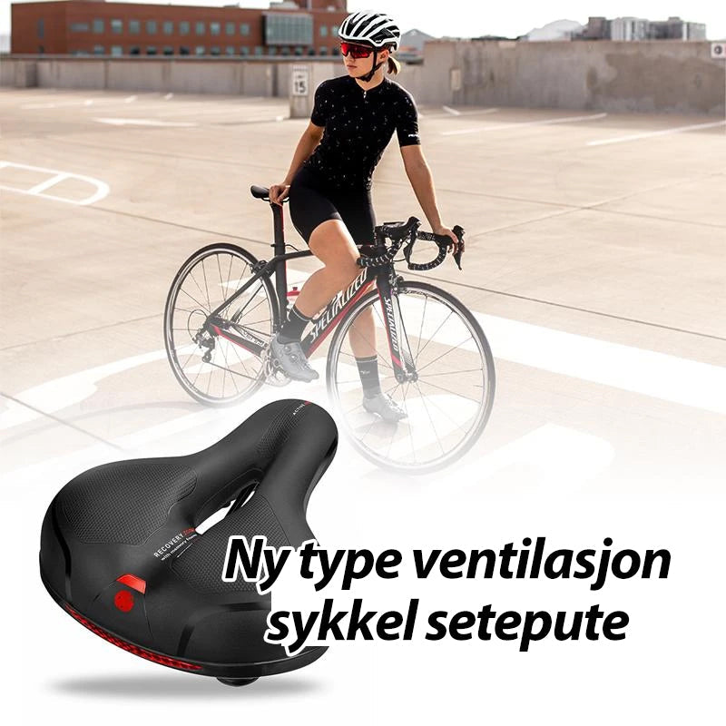 "Sykkel setepute i myk silikon med pustende design, uthevet i blått med luftehull for maksimal komfort på lange turer."