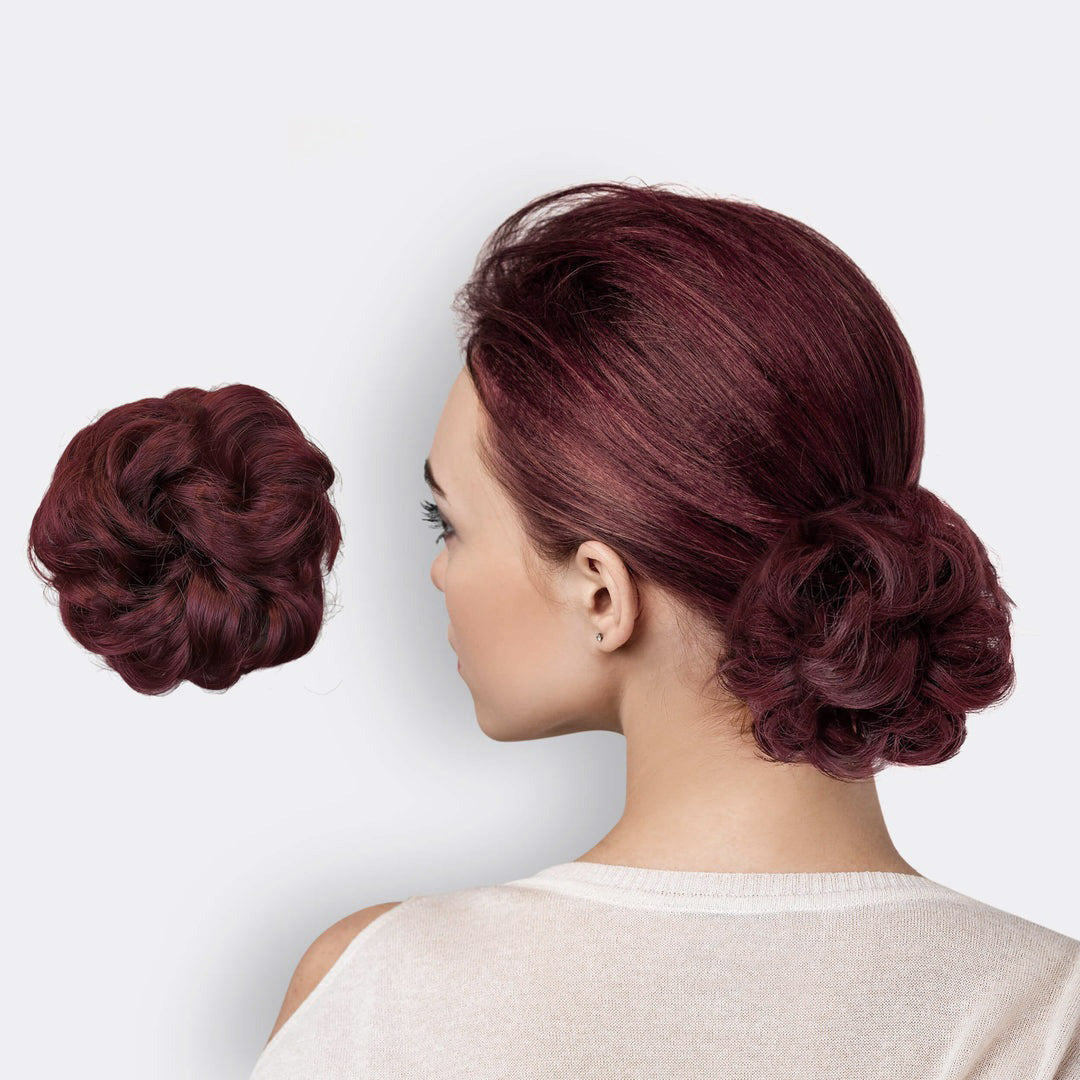 Scrunchie i syntetisk hår for ekstra volum til hårbollen. Enkel og trendy hårpynt.