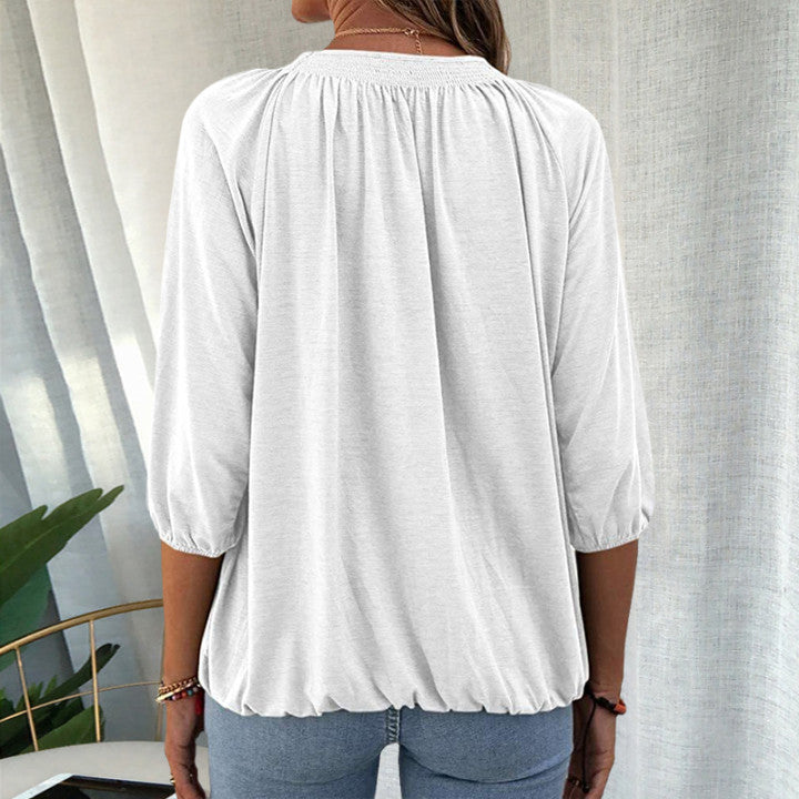 Trekvartermet t-skjorte med rund hals, raglan-erme og ensfarget design, tilgjengelig i flere farger for uformell stil.