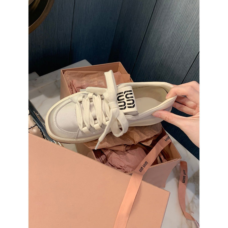 "Trendy dame plattform sneakers i nøytral farge, komfortabel polstring, moderne design, perfekt for enhver anledning."