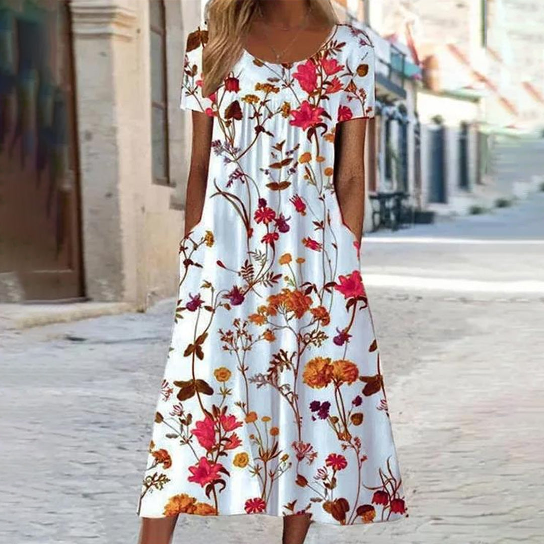 "Uformell sommerkjole med blomsterprint i myk polyester, stråler sommerlig eleganse, perfekt for varme dager og allsidige anl