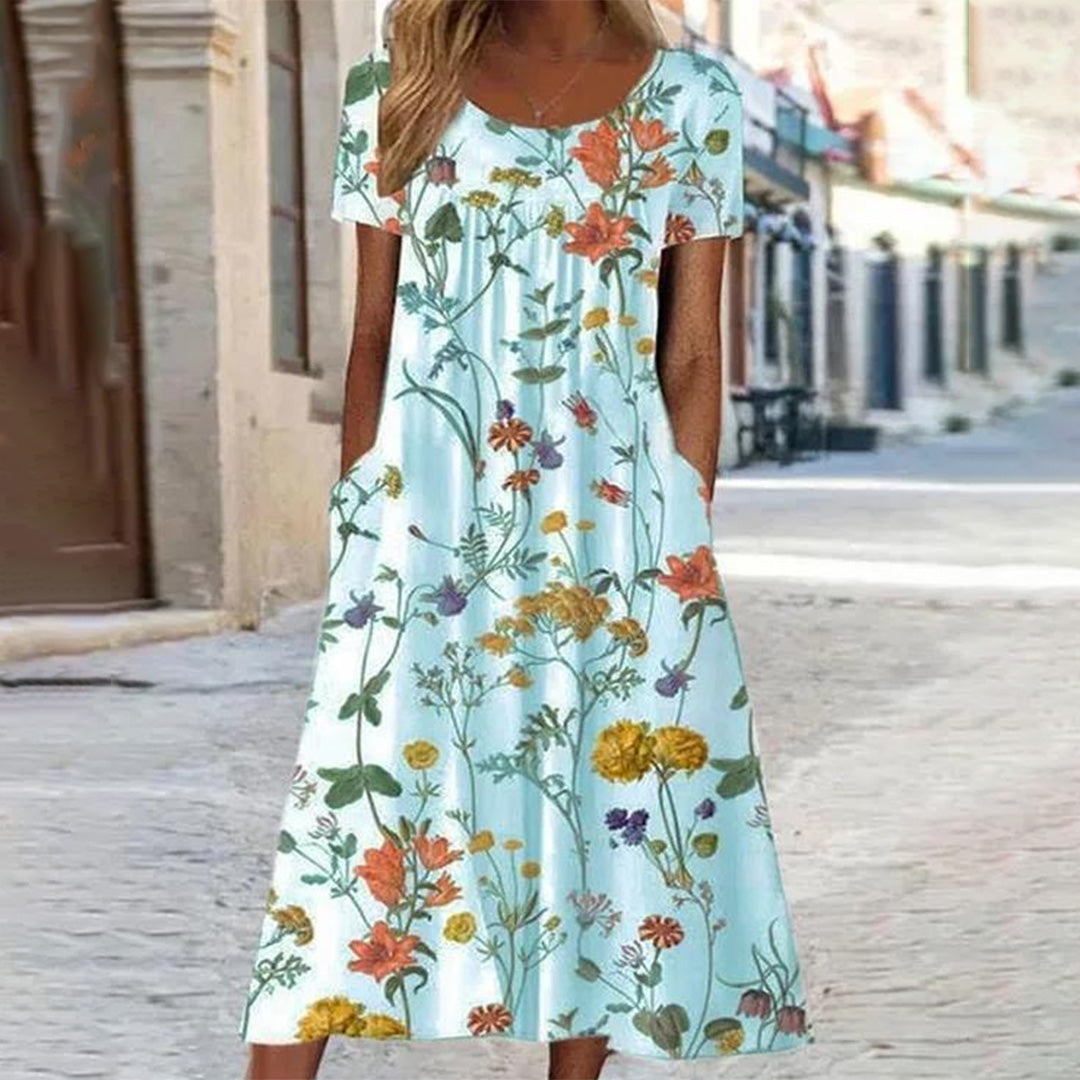 "Uformell sommerkjole med blomsterprint i myk polyester, stråler sommerlig eleganse, perfekt for varme dager og allsidige anl