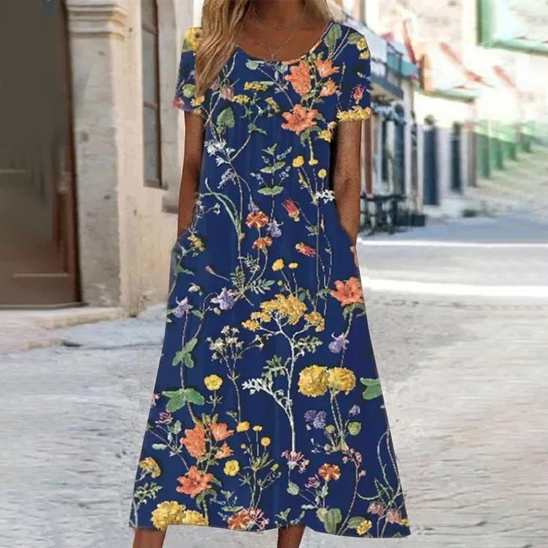 "Uformell sommerkjole med blomsterprint i myk polyester, stråler sommerlig eleganse, perfekt for varme dager og allsidige anl