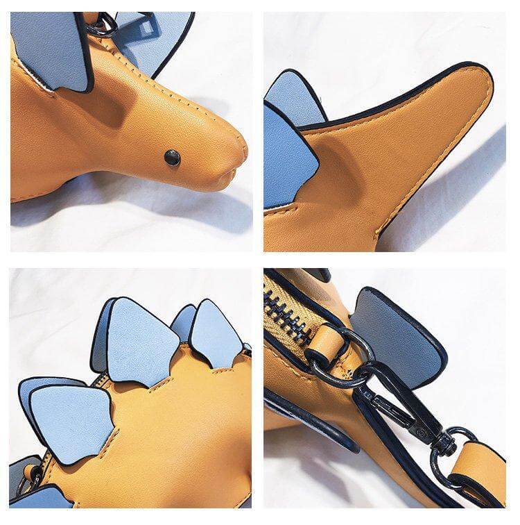 Nærbilde av hodet på en grønn 3D-dinosaur crossbody-veske for barn, med uttrykksfulle øyne.
