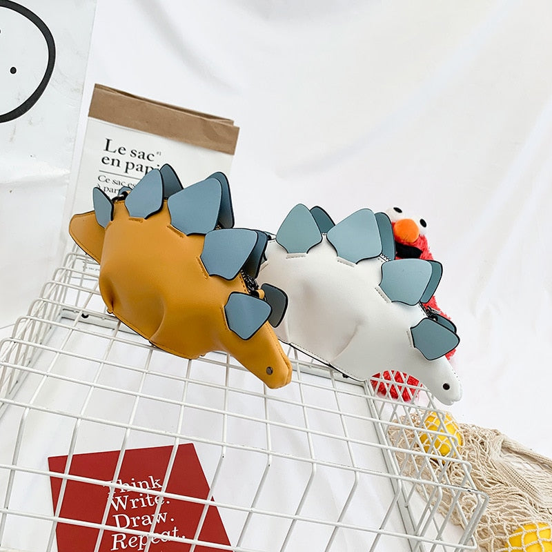 Dinosaurveske for barn, grønn, med 3D-design som en morsom og praktisk crossbody-veske.