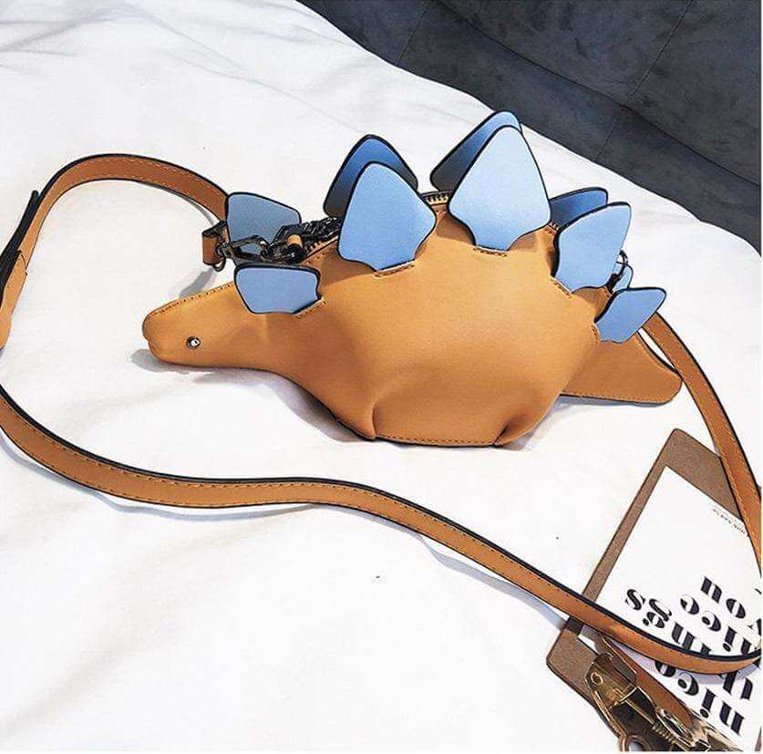 Lekent tilbehør: Grønn dinosaur crossbody-veske for barn, med levende farger og et iøynefallende dyredesign.