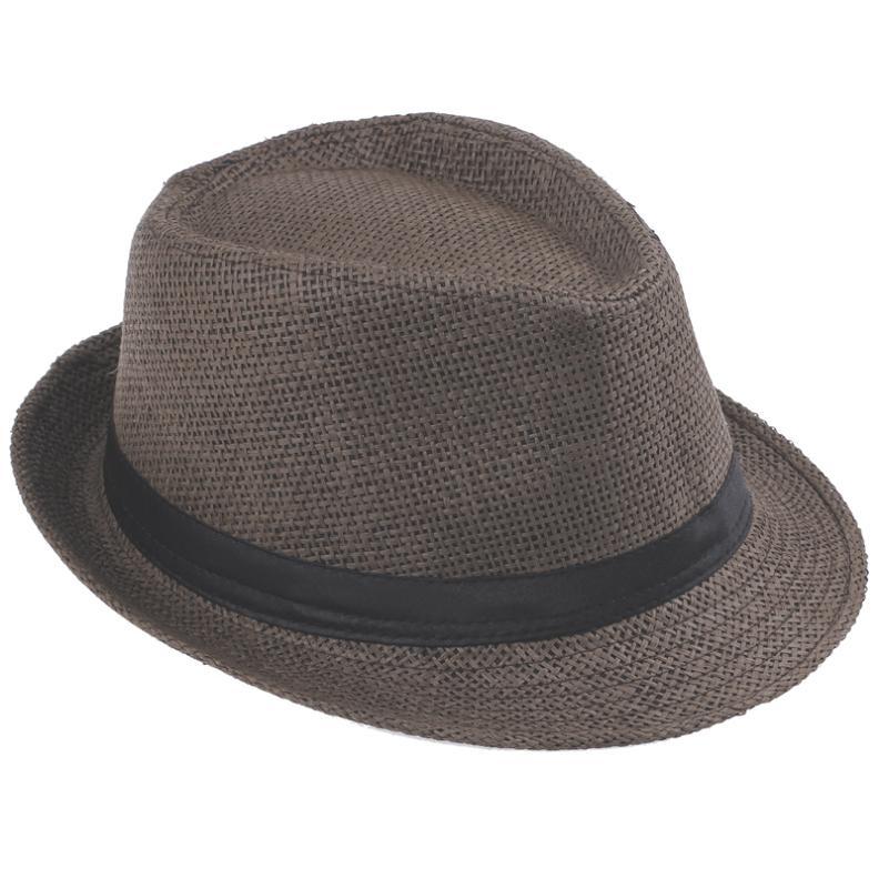 Unisex panama-fedora i beige halm med mørkt bånd, klar for sommer og sol. Strandstil.