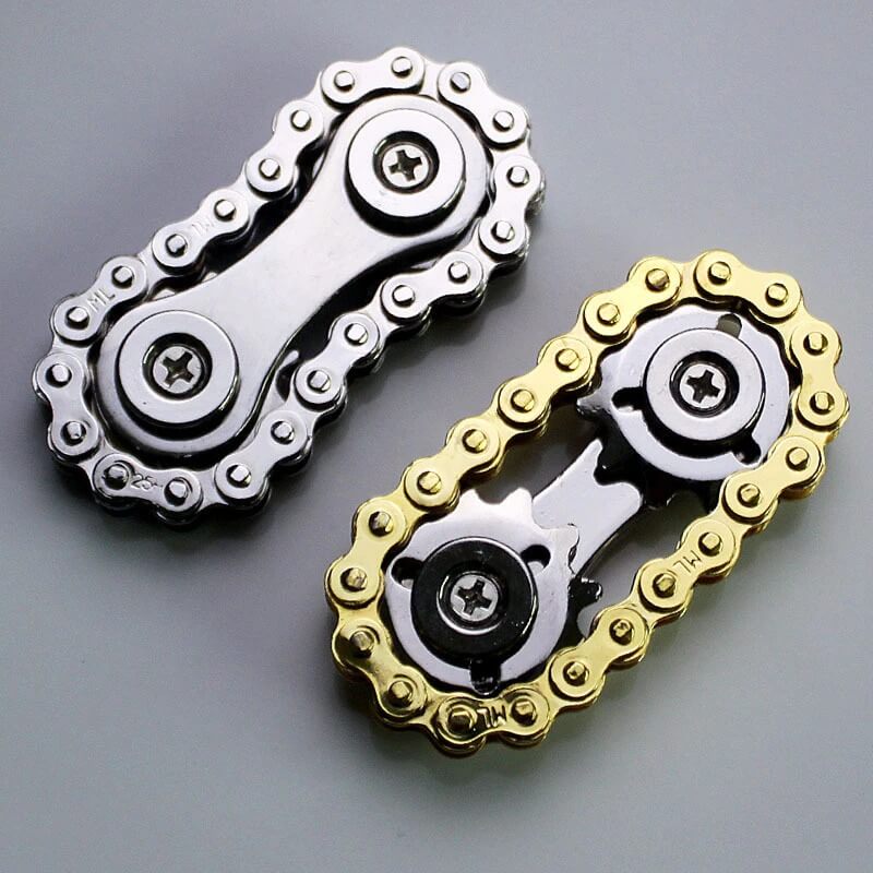 Unisex svinghjuls fingertuppkjede i metall. Stressavlastende fidget leketøy for alle, forbedrer fokus.