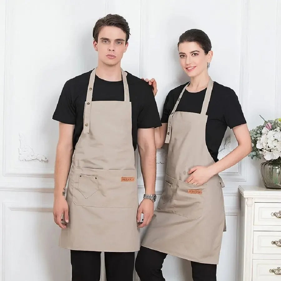 Unisex vanntett kjøkkenforkle i blått, designet for langvarig bruk og beskyttelse under matlaging og baking.