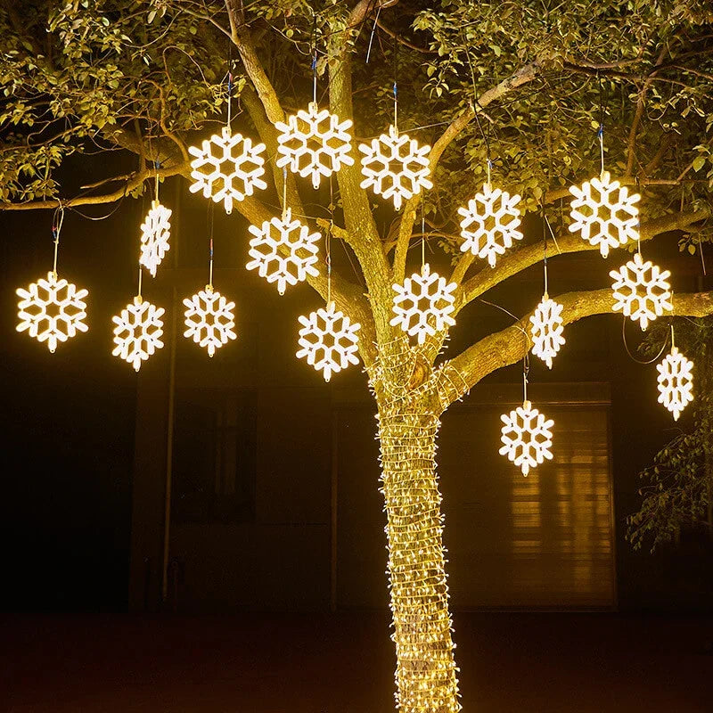 Vanntett utendørs LED-snøfnugglys med glødende snøfnugg i fall, IP65, flere farger, perfekt for juledekorasjon.