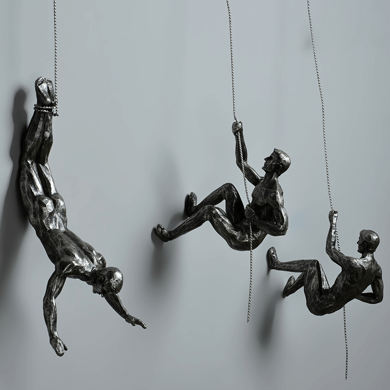 Moderne veggkunst, klatrende figurer i svart, figurativ design, perfekt for hjemmeinnredning