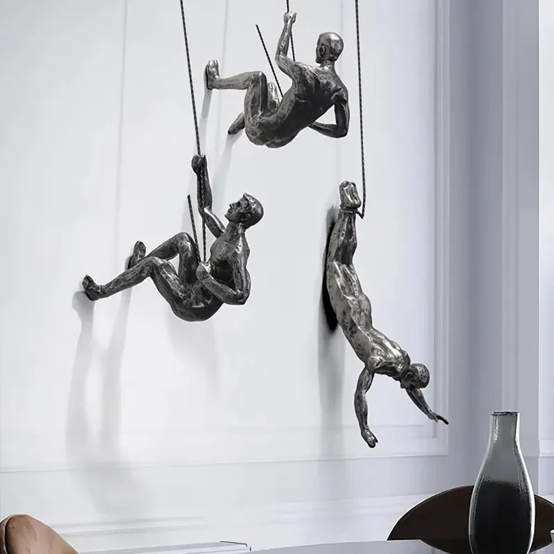 Nærbilde av klatrende figurer, veggkunst for moderne hjem, svart metall, kunstig dekor