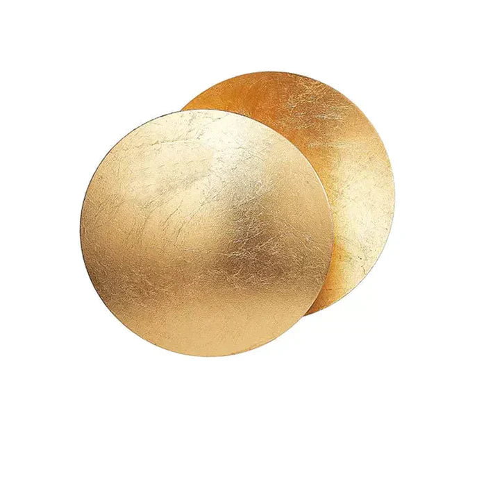 "Vegglampe med solformørkelseffekt, elegant design, to gylne roterende skiver, tilgjengelig i gull og kobber."