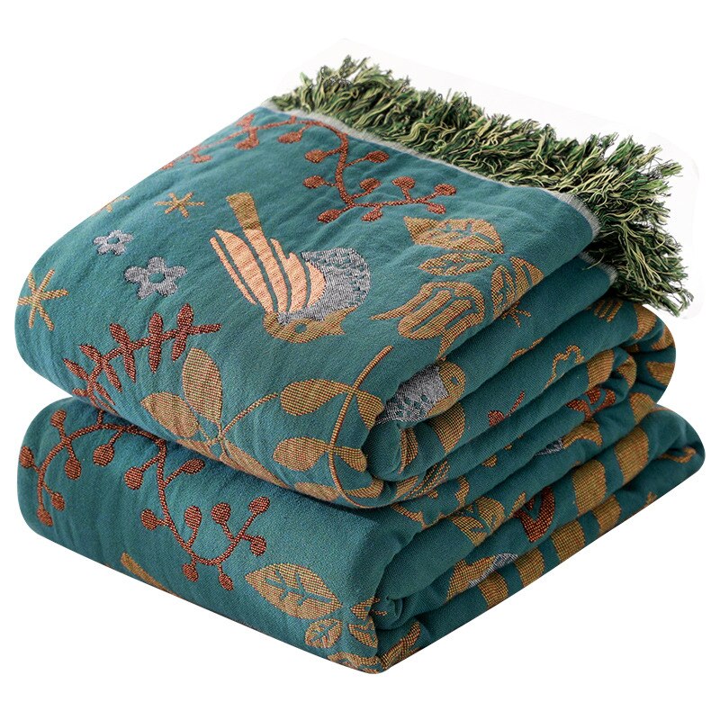 Vintage grønt vendbart trådteppe i bomull med dusker, perfekt for boho dekor. Vaskbart teppe