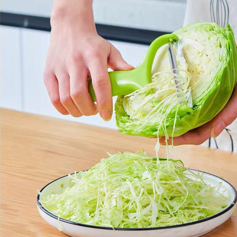 Y-skreller med bredt rustfritt stålblad og ergonomisk plastgrep for enkel skrelling av frukt og grønnsaker.